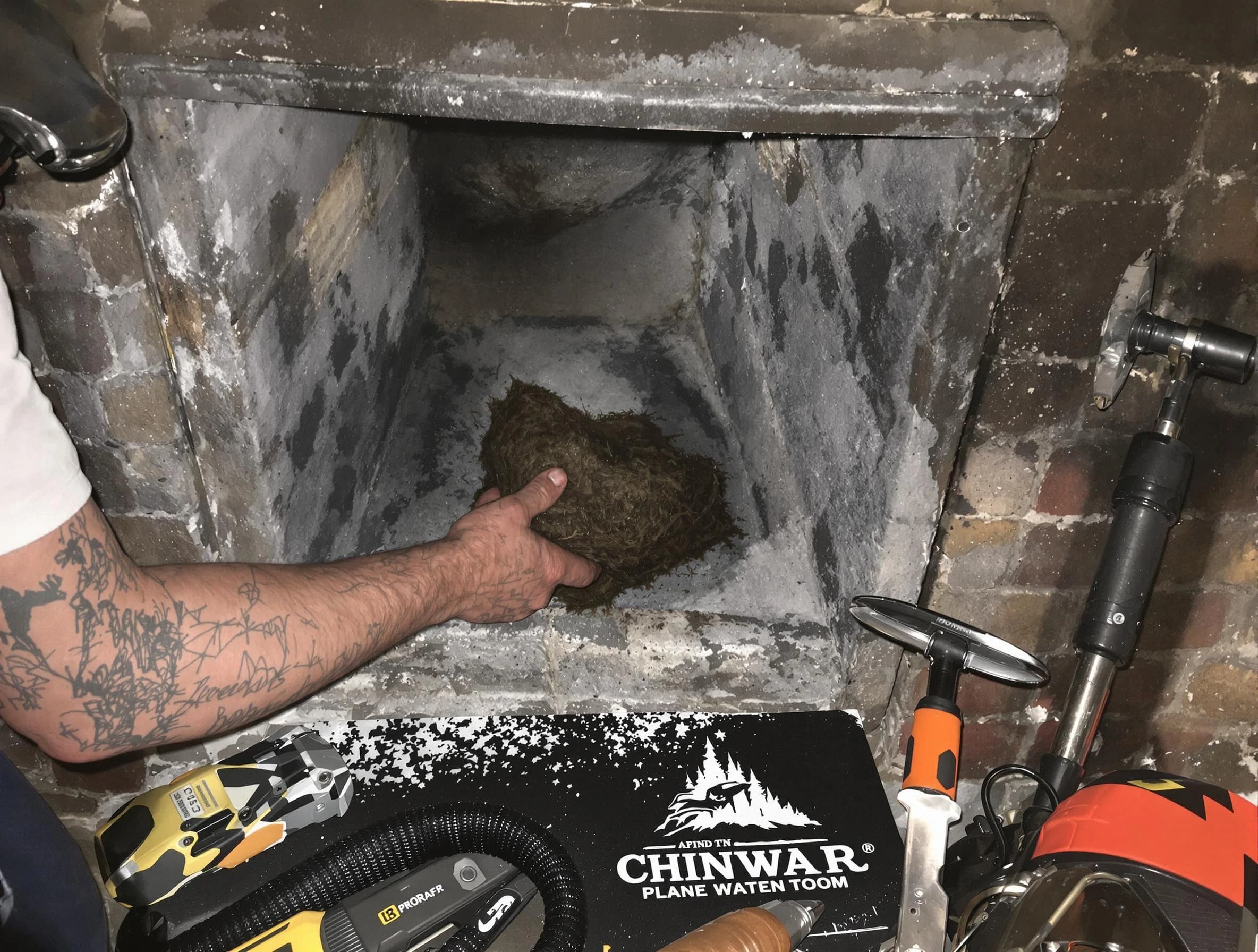 Norman Chimney Sweep safely removing debris and screening chimney in Norman, OK